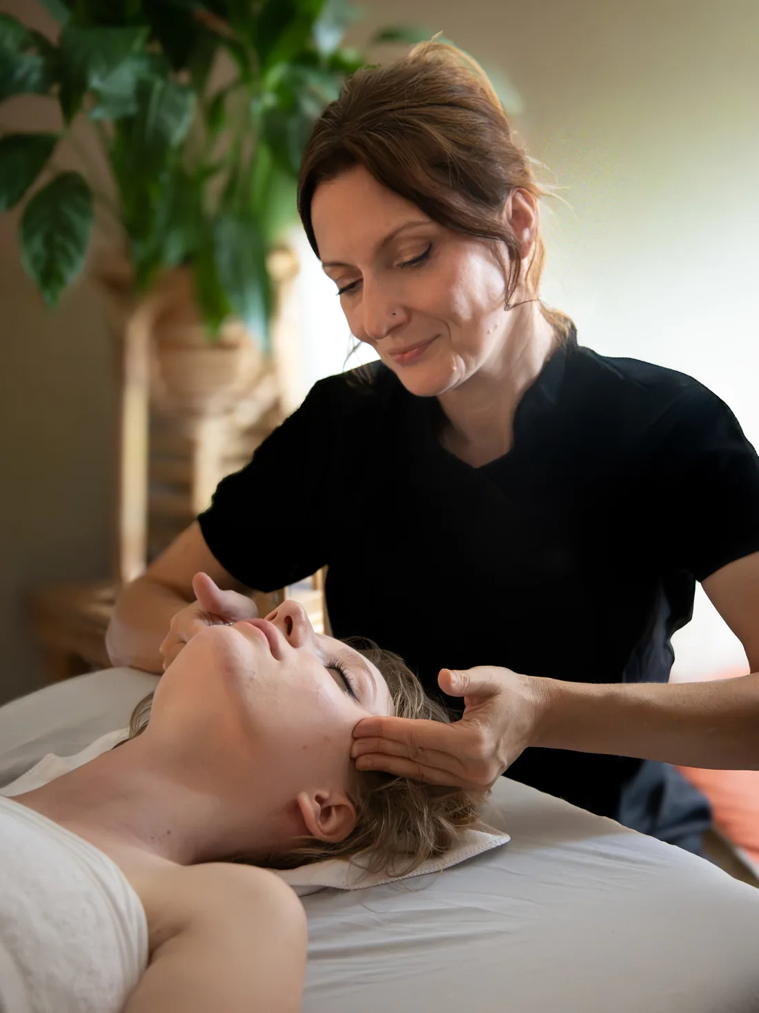 Iwona Williams, VTCT Skills (ITEC) Level 3 qualified massage therapist, working on a client's neck and shoulders